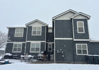 Windows on a grey house viewed from the exterior