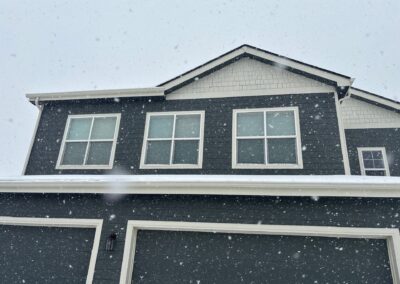 Windows on a grey house viewed from the exterior