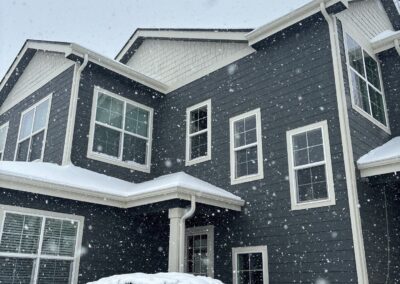 Windows on a grey house viewed from the exterior
