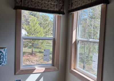 Newly installed windows viewed from the interior of a house