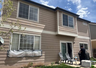 Windows on a tan house viewed from the exterior